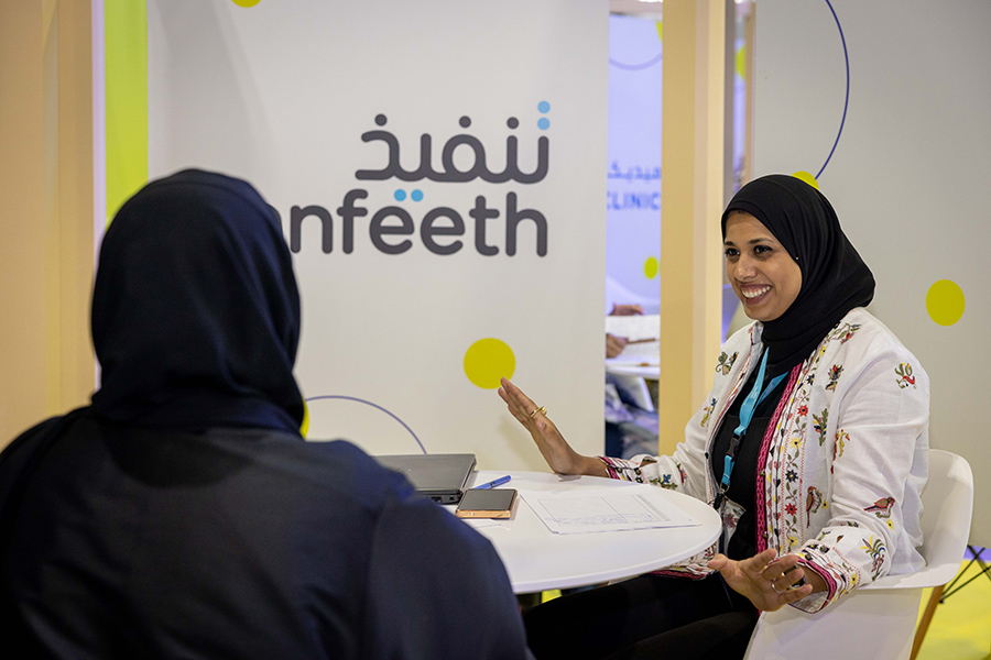 An image of 2 woman talking on Ru'yaa career fair